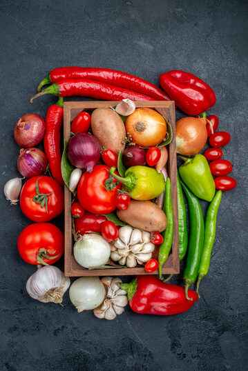 Fresh vegetables arranged on a light surface